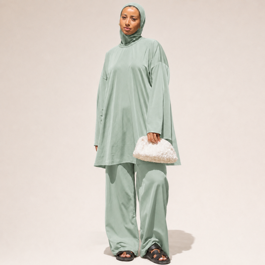 Woman wearing the Light Blue 4-Piece Burkini by Mein Modesty, full modest swimwear set